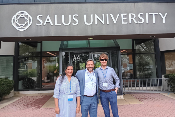 Luis, Sarika and Jeremy standing outside Salus University.