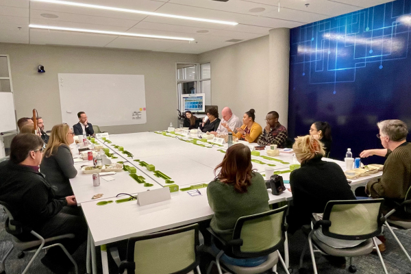 Wichita Business Journal and Envision Partnership Helps Build Bridges Members of the DEICT forums meeting at a conference room within Envision.