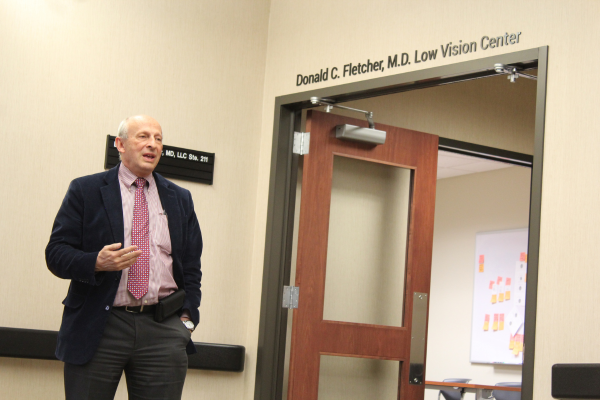 Dr. Fletcher speaks at his reception after the unveiling of the Low Vision Center named in his honor
