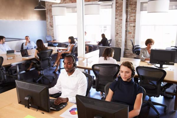 A call center station with 10 employees working on phones.