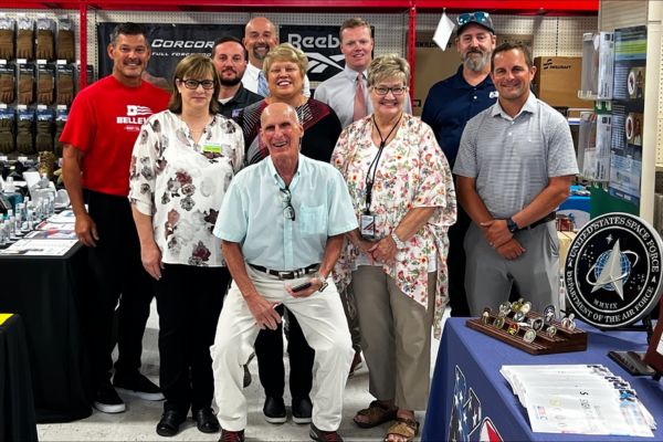 Envision Xpress Vendor Shows Highlight the Importance of Diversity in Employment A group of Envision Xpress Base managers standing together smiling.