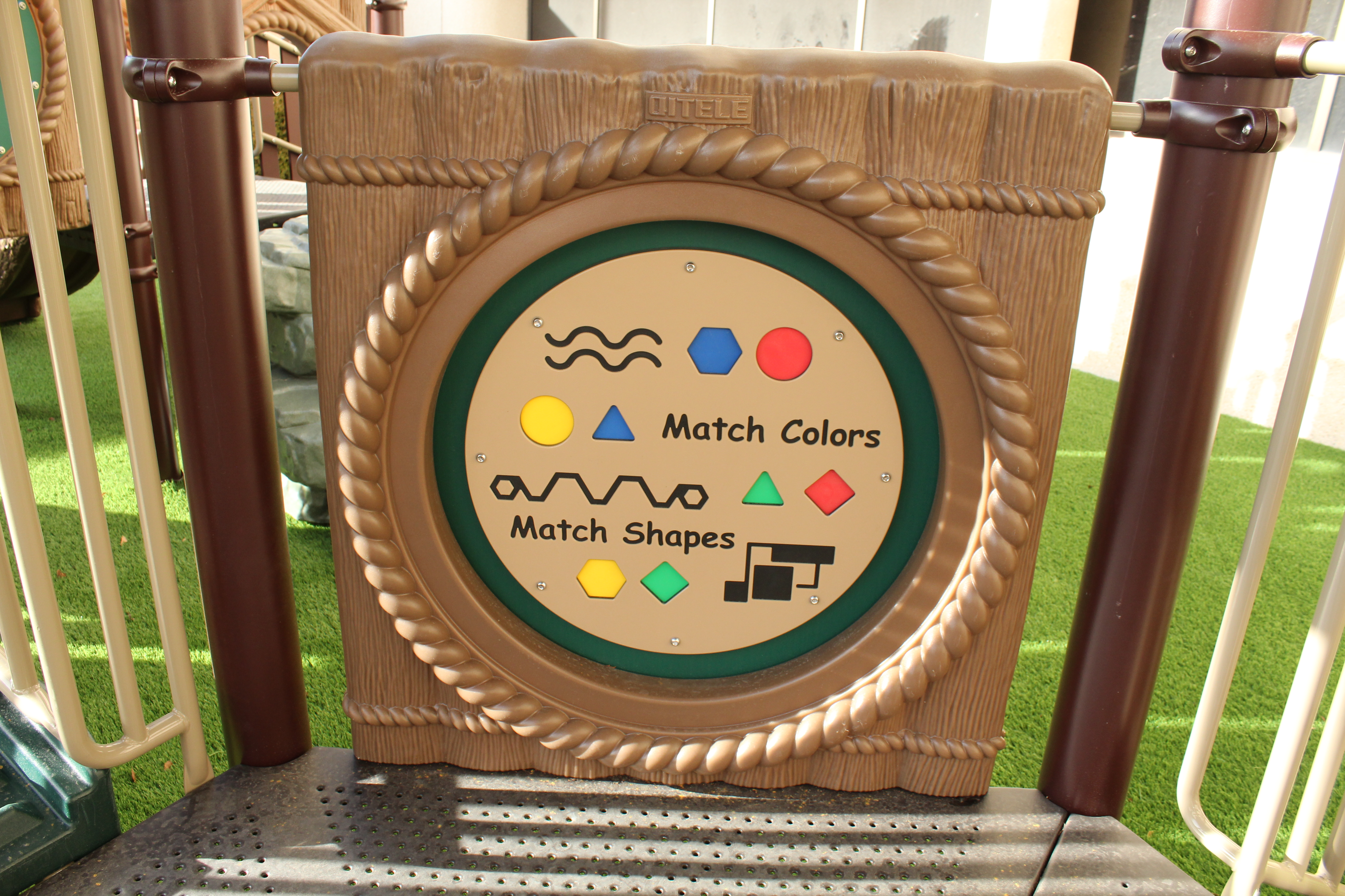 A close shot of an interactive toy on the new playground allowing children to match colors.