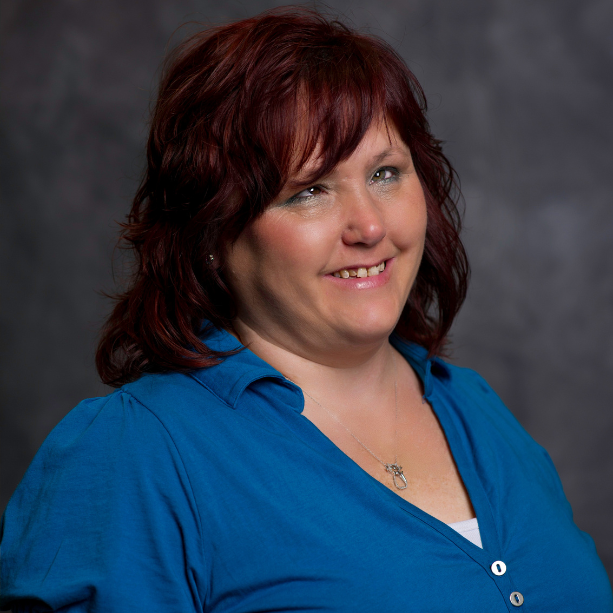 Terese headshot image, smiling at the camera.