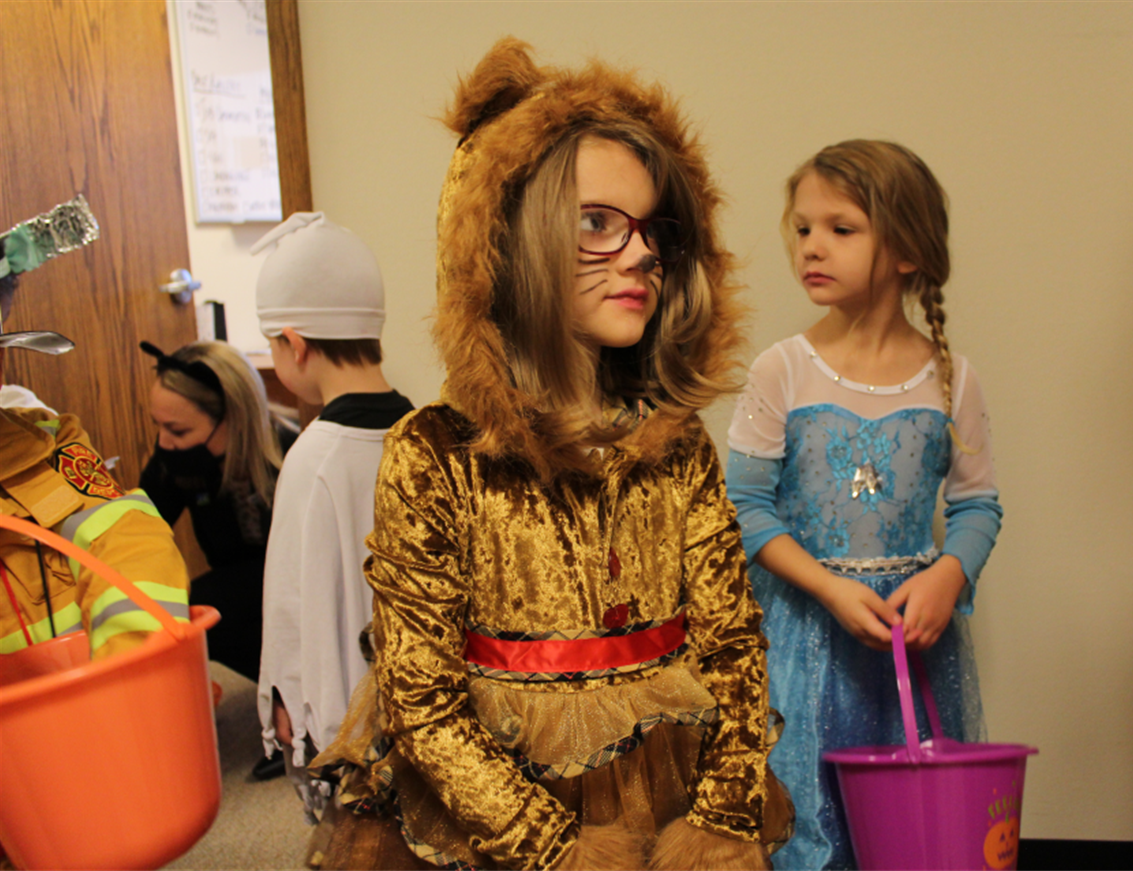 Valynn, who was born on         Halloween, enjoying trick-or-treating with her Preschool classmates.