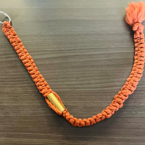 Bert's orange key chain made out of macramé for Terese.