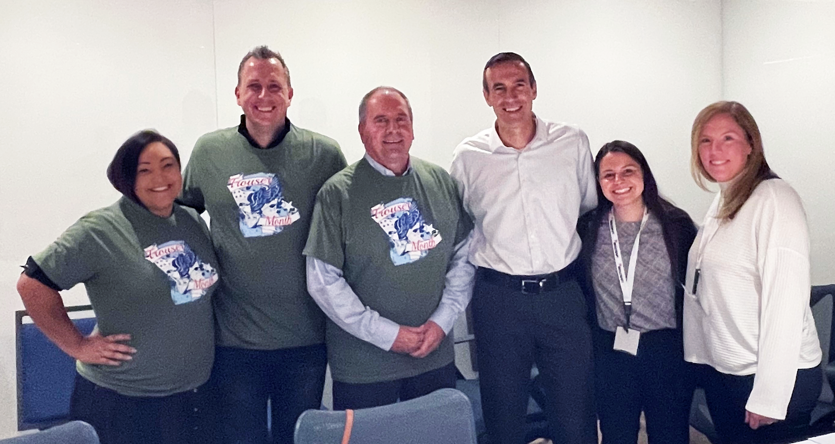 Donielle Lorelli, NIB, David Stupay, Envision Dallas, Gary Colello, NIB, Steve Merch, DLA, Rachel Piecyk, DLA and Catherine Dillon, DLA, celebrate the launch of the Trouser Month contract.