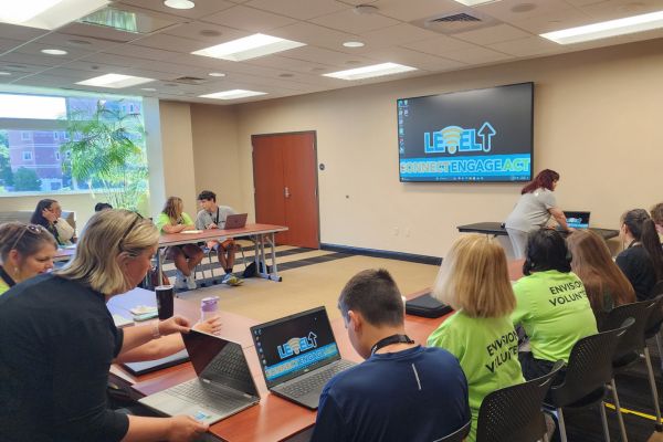 Students who are BVI sitting in a computer lab during an Envision Level Up Cybersecurity class