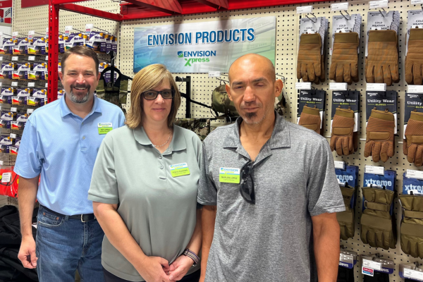 Three base supply staff members smiling for a photo.