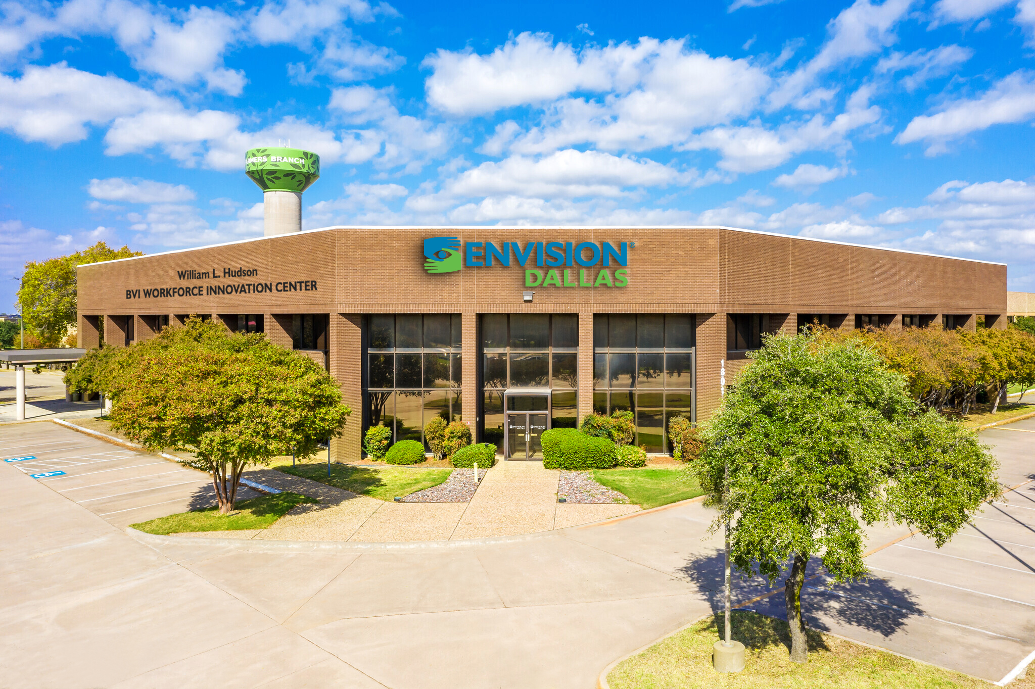 Rendering of the new Envision Dallas building in Farmers Branch with a sign on the of the building that says William L. Hudson BVI Workforce Innovation Center