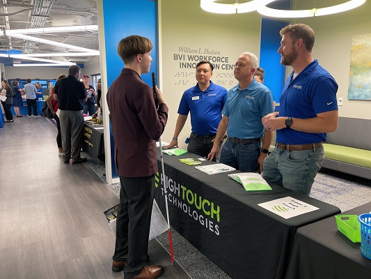 A Level Up student visits the High Touch Technologies booth at the College and Career Expo 