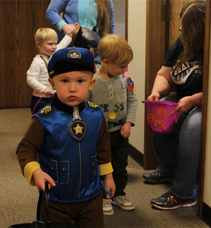 T2 student and Paw Patrol member, Hayden, parading with friends and visiting Envision staff.