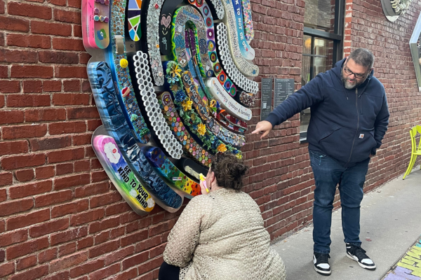 A girl writing in chalk on the fingerprint.