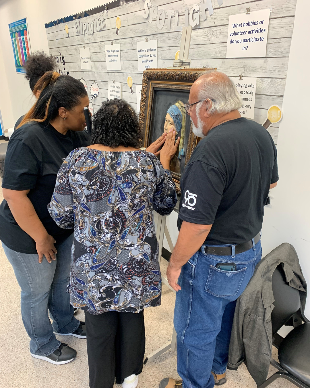 Two people feeling Tomas Bustos' tactile artwork.