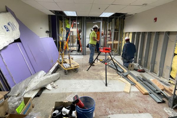 Construction workers beginning renovations at PRIDE.