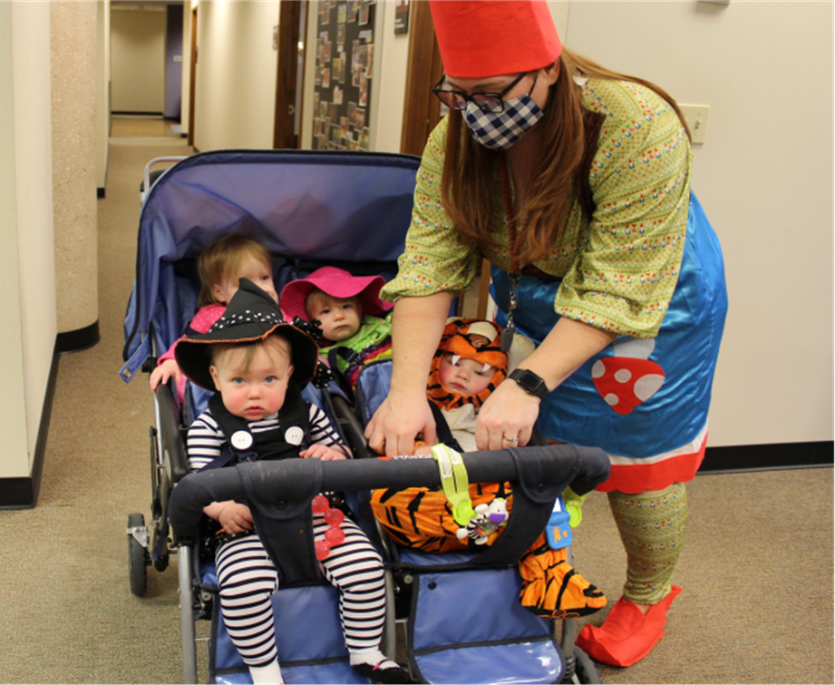 Sarah-Kaehler-and-babies.png Sarah Kaehler, Early Childhood Educator in the Nursery, and four of their babies, parading on the 4th floor.