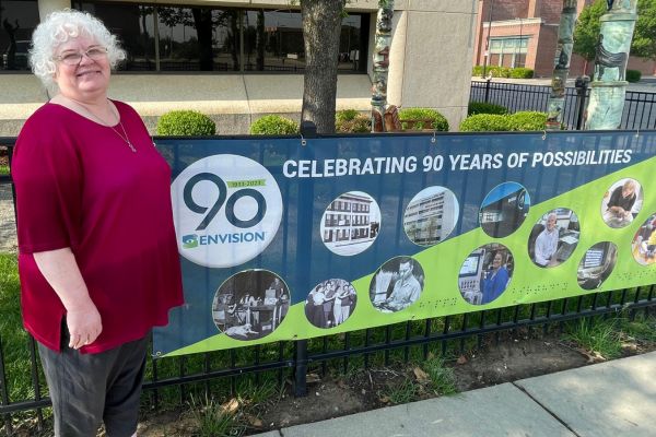 Celebrating 90 Years of Envision: What Envision Means to Me - Regina An image of Regina next to the Envision 90th birthday logo