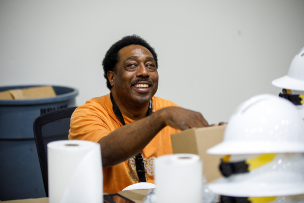 Paul Williams smiles as he works on the manufacturing floor.