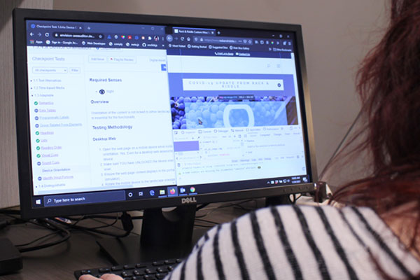 Digital Accessibility in Retail Spaces: Why is digital accessibility important? Envision Workforce Innovation Center employee analyzing the accessibility of a website