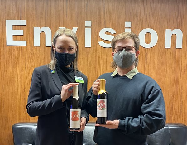 Meet the Artists behind Envision Arts Wine Labels Artist Tomiyo standing in gallery alley