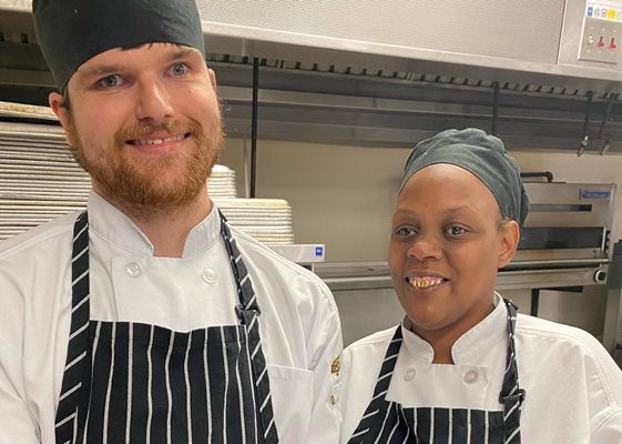 L-R: Charlie Wilks and Deyounka Nelson show off their culinary talents.