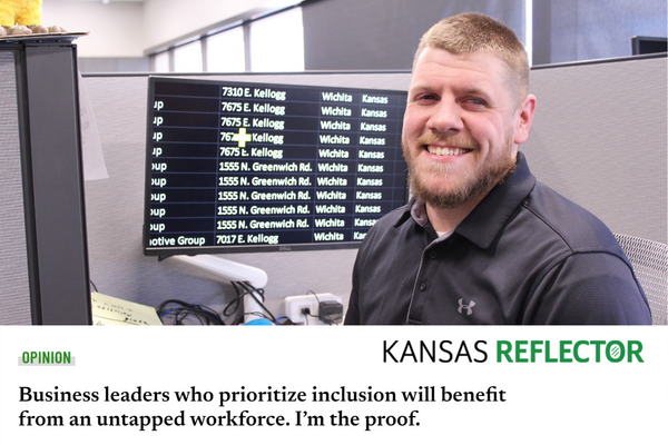 Kyle Shaults Opinion Story Featured in Kansas Reflector A photo of Kyle sitting at his computer smiling with a story headline at the bottom