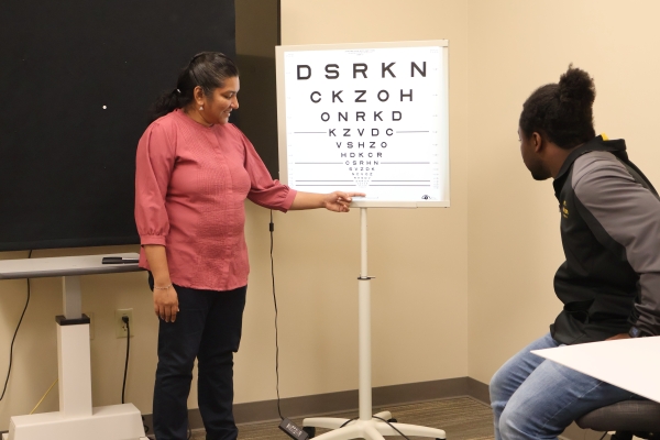 How the Envision Research Institute (ERI) Uses Technology to Shape the Future of Independence Sarika Gopalakrishnan, PhD, FAAO, explains an eye chart used in her research.