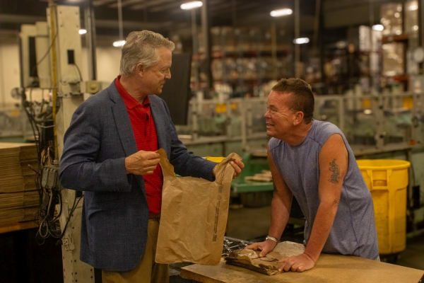Advocacy in Action: Envision Partnering with NIB to Expand Opportunities Senator Marshall discusses plastic bags with Wichita Envision employee Kelly Leonard.