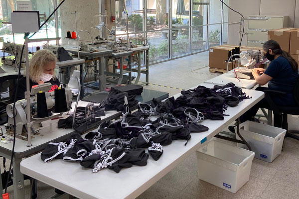 Stay safe during COVID-19 Women sewing masks at Envision Dallas contributing to prevention efforts during the pandemic.
