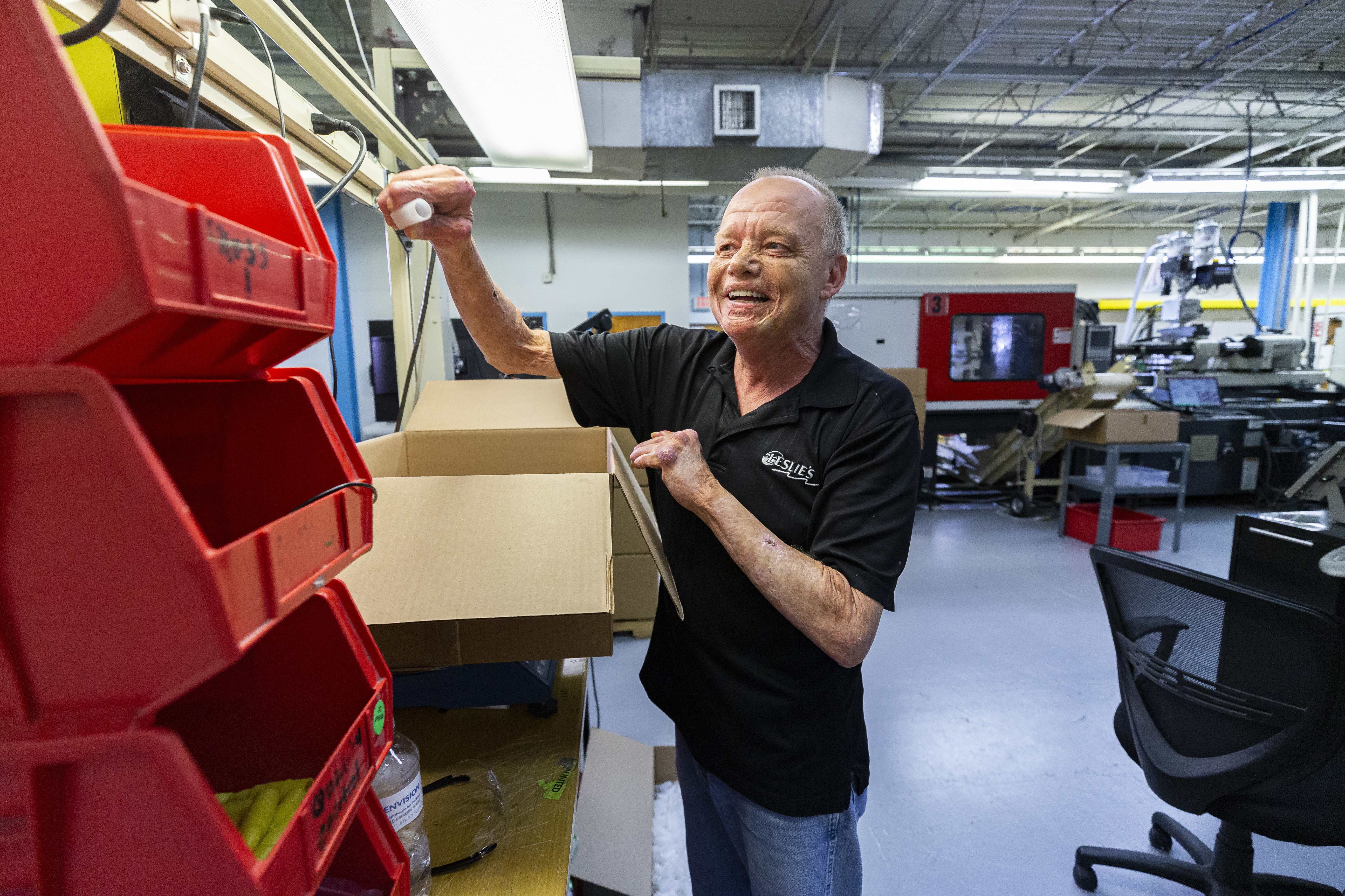 Envision Dallas manufacturing employee putting together markers made at the facility.