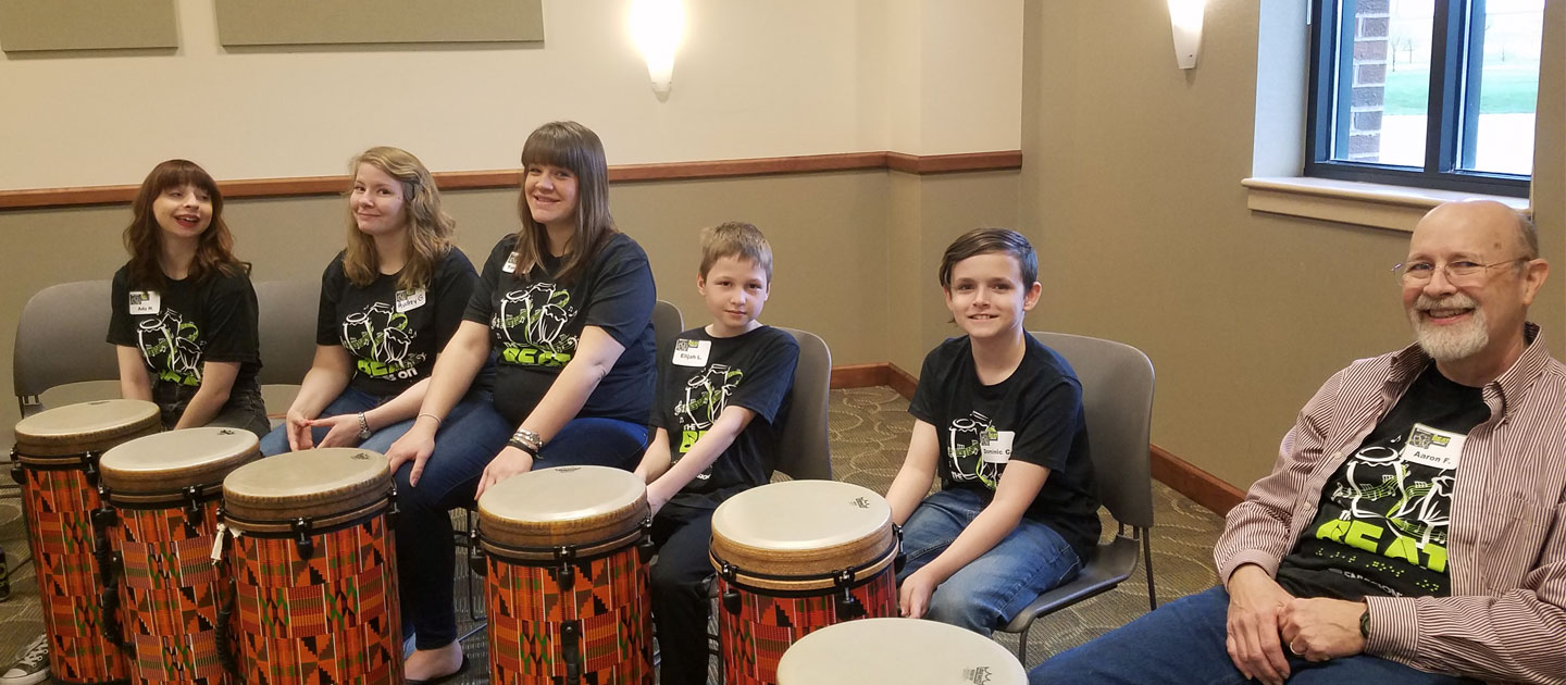 Participants at the Beat Goes On event are ready to play their drums.