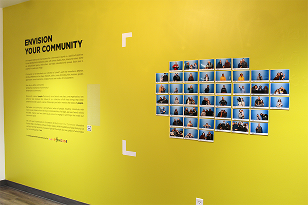 a yellow wall with text on it that says envision your community and a collage of pictures from gallery guests
