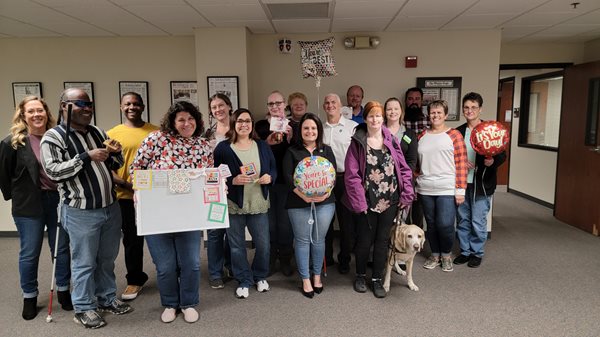 Group image of Customer Service Team in Wichita smiling and celebrating the week