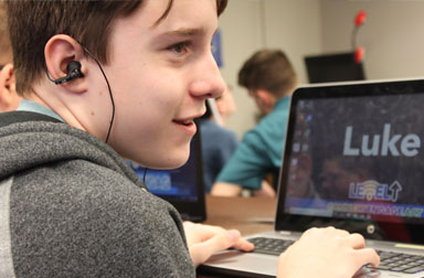 Boy who is visually impaired learns new skills at Level Up assistive technology camp.