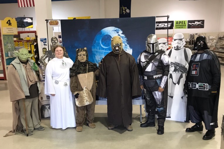 Lemoore staff dressed in star wars costume for Halloween in their store