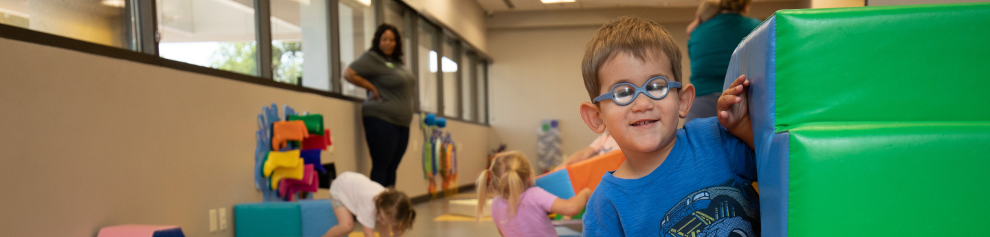 Kid playing in a classroom