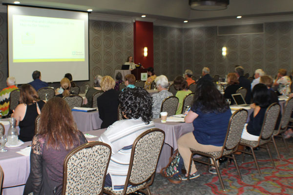 Attendees listen to a speaker at the Kansas Vision Summit.