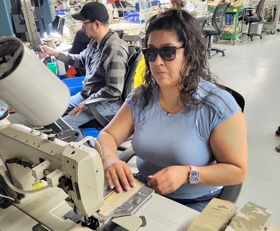 Mariela at the sewing machine at Envision Dallas