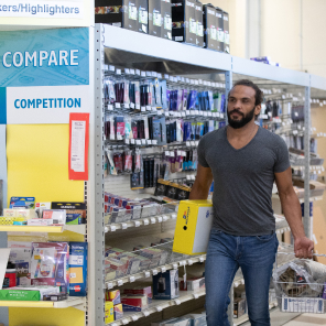 Man who is in the military shops for supplies at an Envision Xpress store.