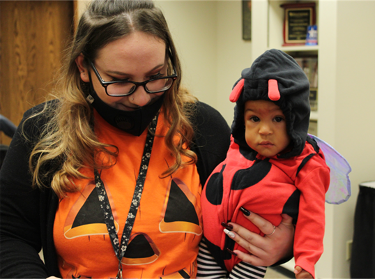 ECDC Monthly Recap - October 2021 Madison Kester, Early Childhood Educator in the Nursery and a very cute lady bug named Bella.