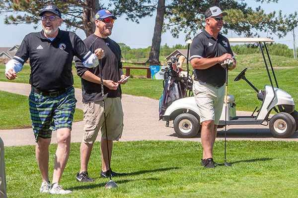 Golfers at the Wichita tournament enjoy a moment together.