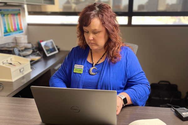 Woman who is blind using her computer to look at a website