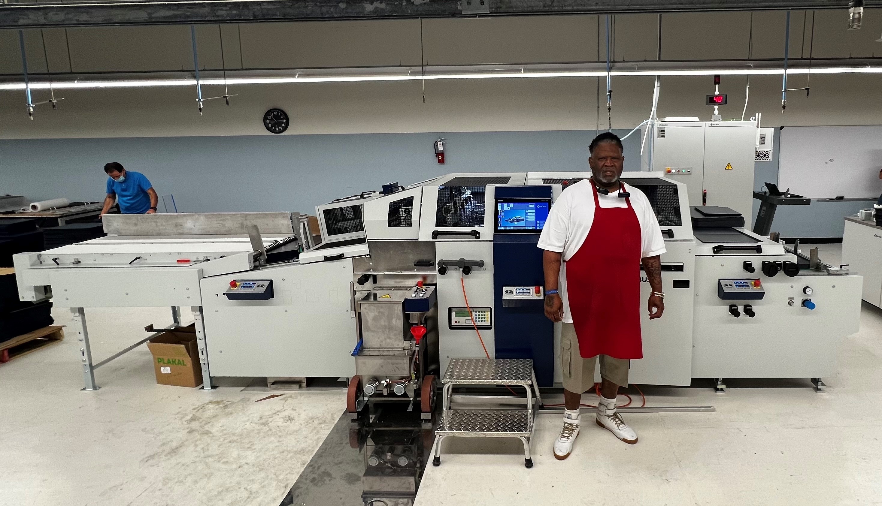 Charles Seville operates the new machinery at the Envision Dallas facility.