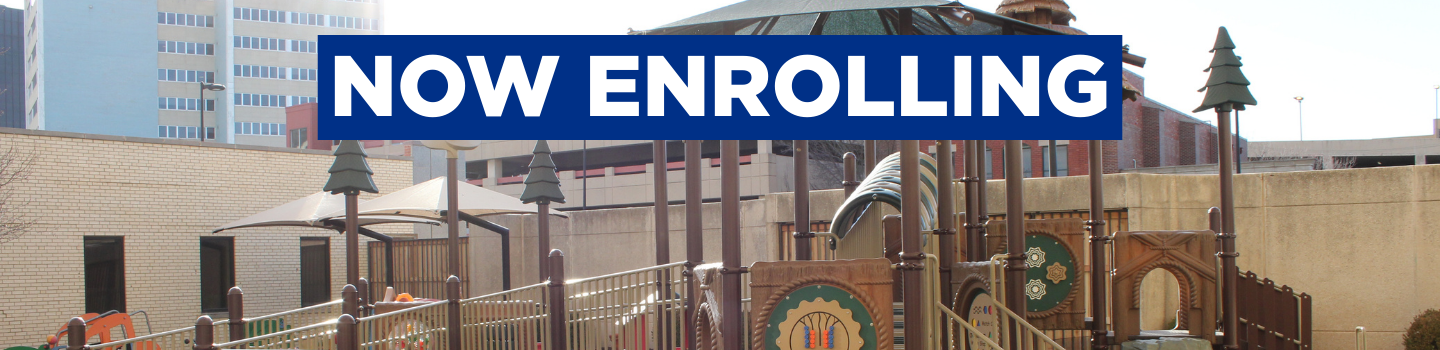 A bright, welcoming classroom art area with colorful cubbies filled with folders, children’s books on top, and kid-sized tables and chairs creating an inclusive, inviting space for all learners.