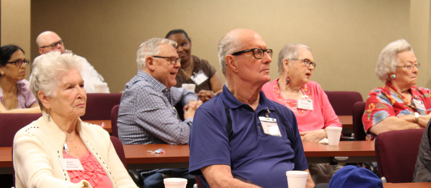 Participants at the Adult Support Group listen and learn at the monthly meeting.